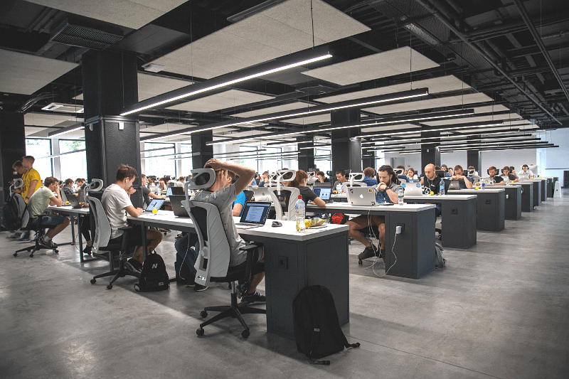 open office layout with crammed workers